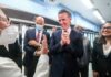 Newsom BETRAYS Woke Left — Democrats EXPLODE Group of people engaged in a lively discussion during a public event