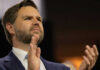 Vance’s SHOCKING Lead: 2028 GOP Frontrunner? Person clapping enthusiastically in formal attire