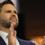 Person clapping enthusiastically in formal attire