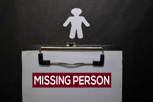 Clipboard with missing person sign and silhouette figure