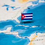 Cuban Oil Embargo Showdown – Russian Provocation A small Cuban flag placed on a map highlighting Cuba in the Caribbean