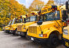$22 Million LAUSD Scandal Rocks Education System Row of yellow school buses parked in an autumn setting