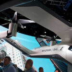 Futuristic air vehicle displayed at a technology event