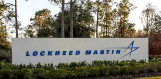 Sign displaying the Lockheed Martin logo in a landscaped area