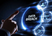 A hand pointing at the words 'DATA BREACH' surrounded by digital icons