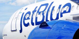 Close-up of a JetBlue airplane showcasing its logo and engine