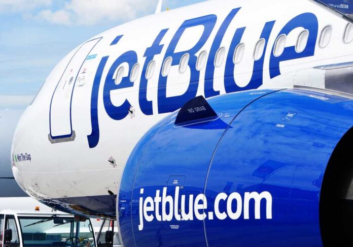 Close-up of a JetBlue airplane showcasing its logo and engine