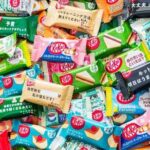 A variety of KitKat chocolate bars in colorful wrappers displayed together