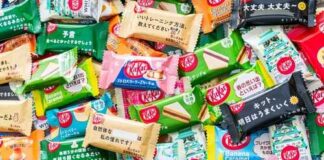 A variety of KitKat chocolate bars in colorful wrappers displayed together