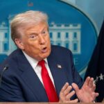 A government official speaking passionately at a press conference