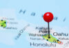 A close-up of a map showing Oahu, Hawaii, with a red location pin