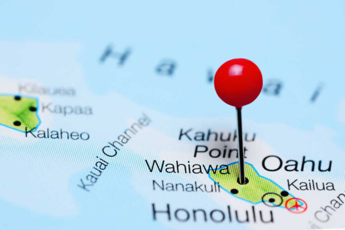 A close-up of a map showing Oahu, Hawaii, with a red location pin
