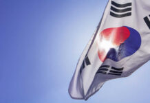 South Korean flag waving against a clear blue sky