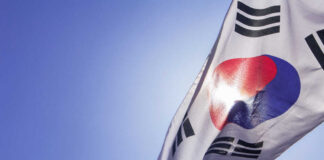 South Korean flag waving against a clear blue sky