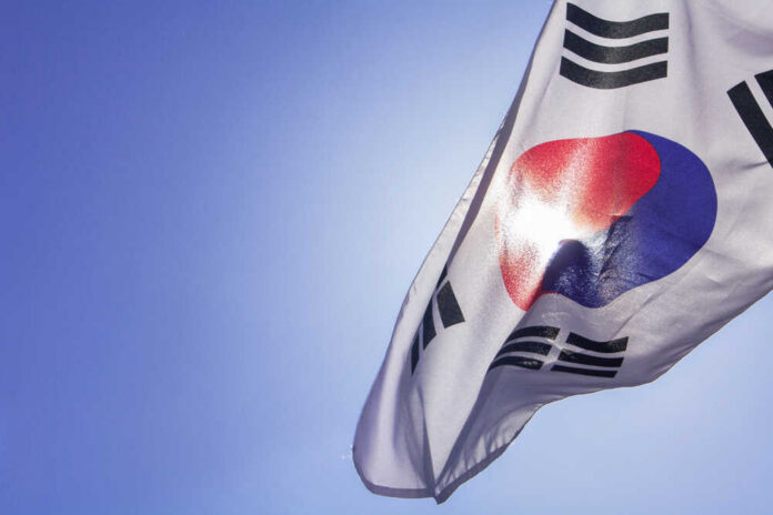 South Korean flag waving against a clear blue sky