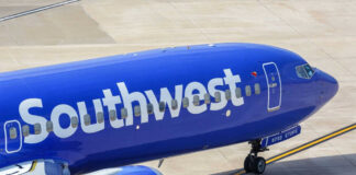 Southwest Airlines airplane on airport tarmac.