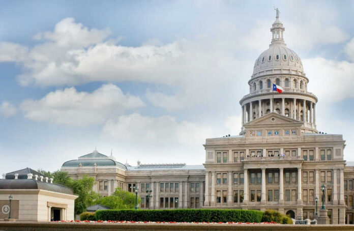Capitol building with dome and Texas flag displayed