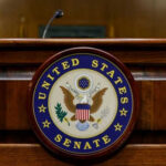 United States Senate emblem on wooden podium