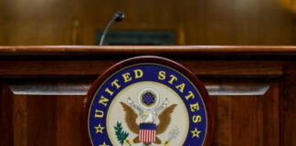 United States Senate emblem on wooden podium