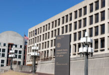Exterior view of the United States Department of Labor building with flags