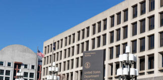 Exterior view of the United States Department of Labor building with flags