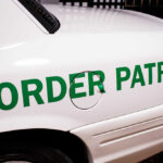 Close-up of a border patrol vehicle with green lettering