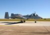 A military A-10 Thunderbolt aircraft on a runway