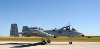 A military A-10 Thunderbolt aircraft on a runway