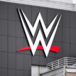 Balor’s Demon Returns – WrestleMania’s Explosive Showdown! WWE logo displayed on a building exterior