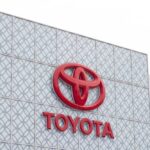 Close-up of the Toyota logo on a building facade