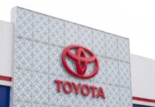 Close-up of the Toyota logo on a building facade