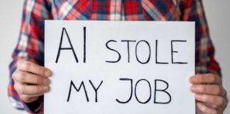 Person holding a sign that reads 'AI stole my job'