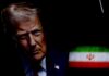 Iran’s Next Move: Will They Defy Trump’s Ultimatum? Close-up portrait of a man with a serious expression, with the Iranian flag in the background