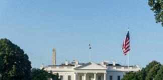 The White House with the Washington Monument in the background