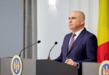 A government official speaking at a press conference