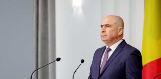 A government official speaking at a press conference