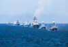 UK’s Bold Naval Gambit Shakes Arctic Balance A fleet of warships sailing in formation on the ocean