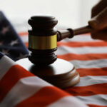 Recusal Bombshell: Discipline File Meets Election Fight Gavel and hand on American flag.