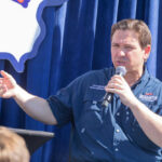 Legal Showdown Looms: FL Map vs. Fair Districts Person speaking into microphone during public event