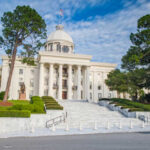 Alabama’s Controversial Map: Democrats on Edge Exterior view of a historic government building with a dome and landscaped grounds