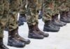 Wounded Soldier MOCKED — Senate Candidate Under Fire Row of soldiers in camouflage uniforms standing at attention with military boots