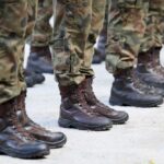 Wounded Soldier MOCKED — Senate Candidate Under Fire Row of soldiers in camouflage uniforms standing at attention with military boots