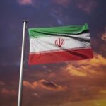 Trump’s Bold Ceasefire Claim: Is Iran Testing It? Iranian flag waving against a sunset sky