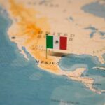 Map highlighting Mexico with a small flag