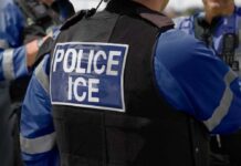 Immigration Detention Protest Sparks Viral Confusion Close-up of a police officer's vest with 'POLICE ICE' insignia