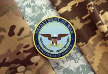 Department of War insignia on camouflage fabric