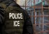 Police officer in tactical gear standing in a detention center