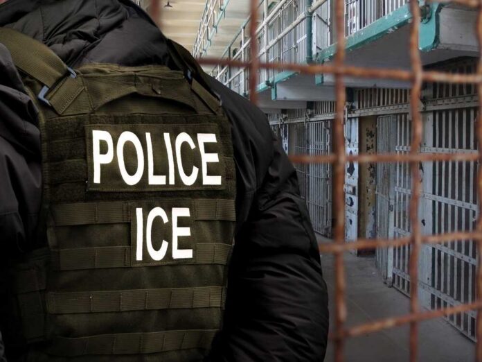 Police officer in tactical gear standing in a detention center