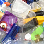 A pile of assorted plastic containers and bottles