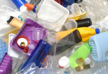 A pile of assorted plastic containers and bottles
